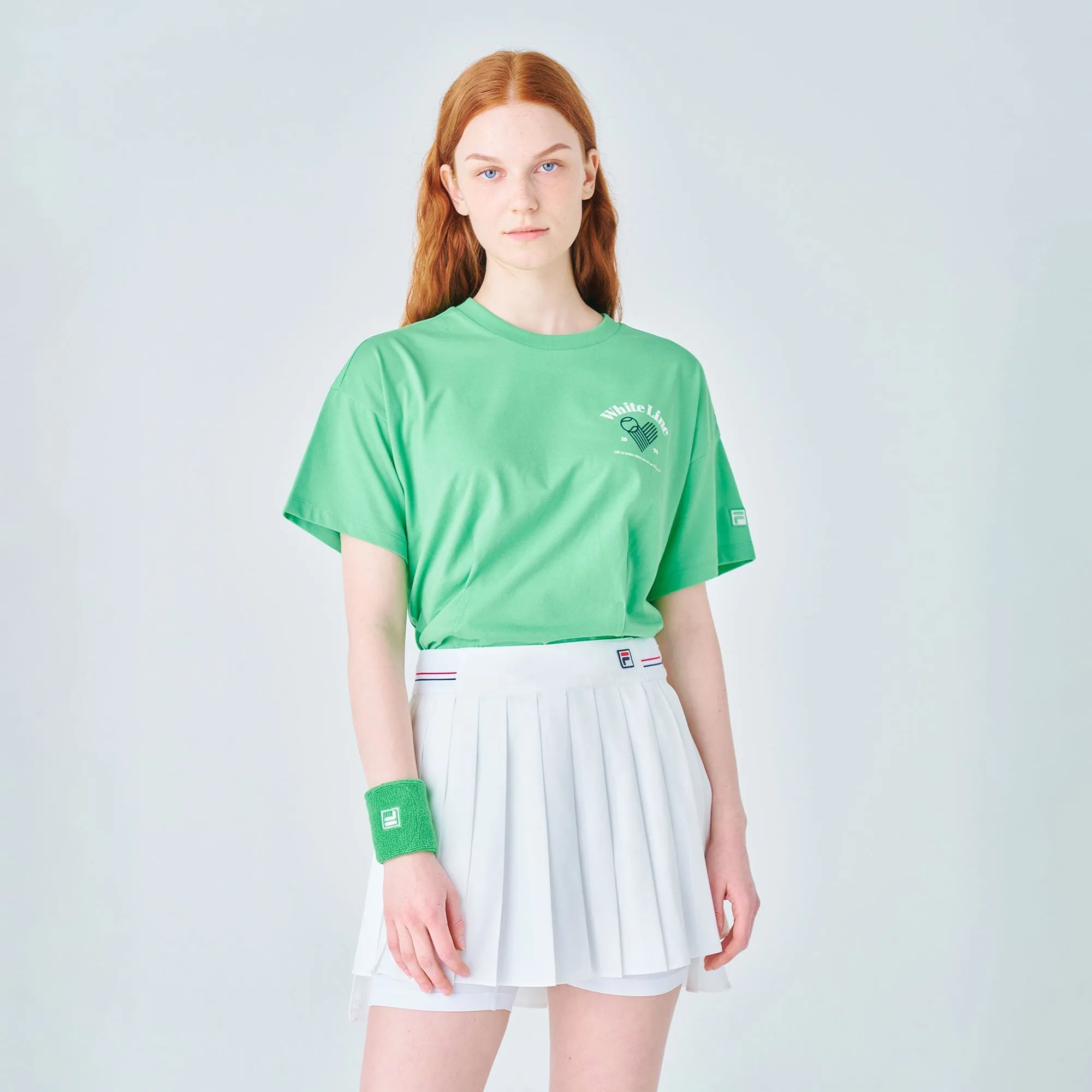 Áo Crop-Top Tay Ngắn Thời Trang Nữ Fila Lady Tennis Life Pintuck - Xanh Lá